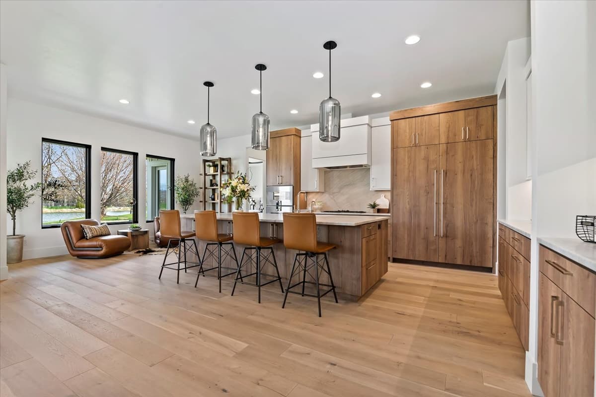 Open kitchen with quartz island and leather stools