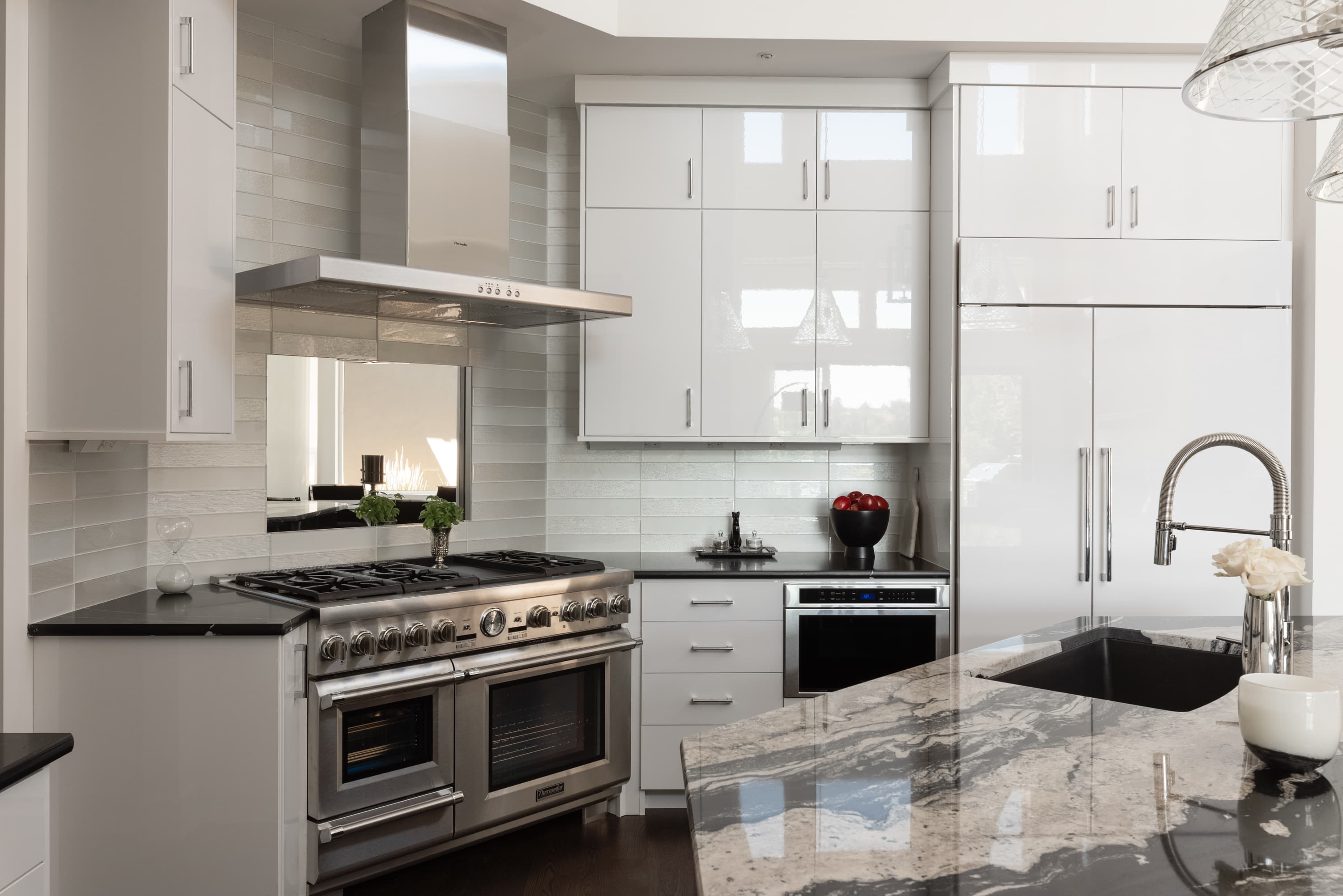 Black granite kitchen countertops with professional range — Superior Stone Boise