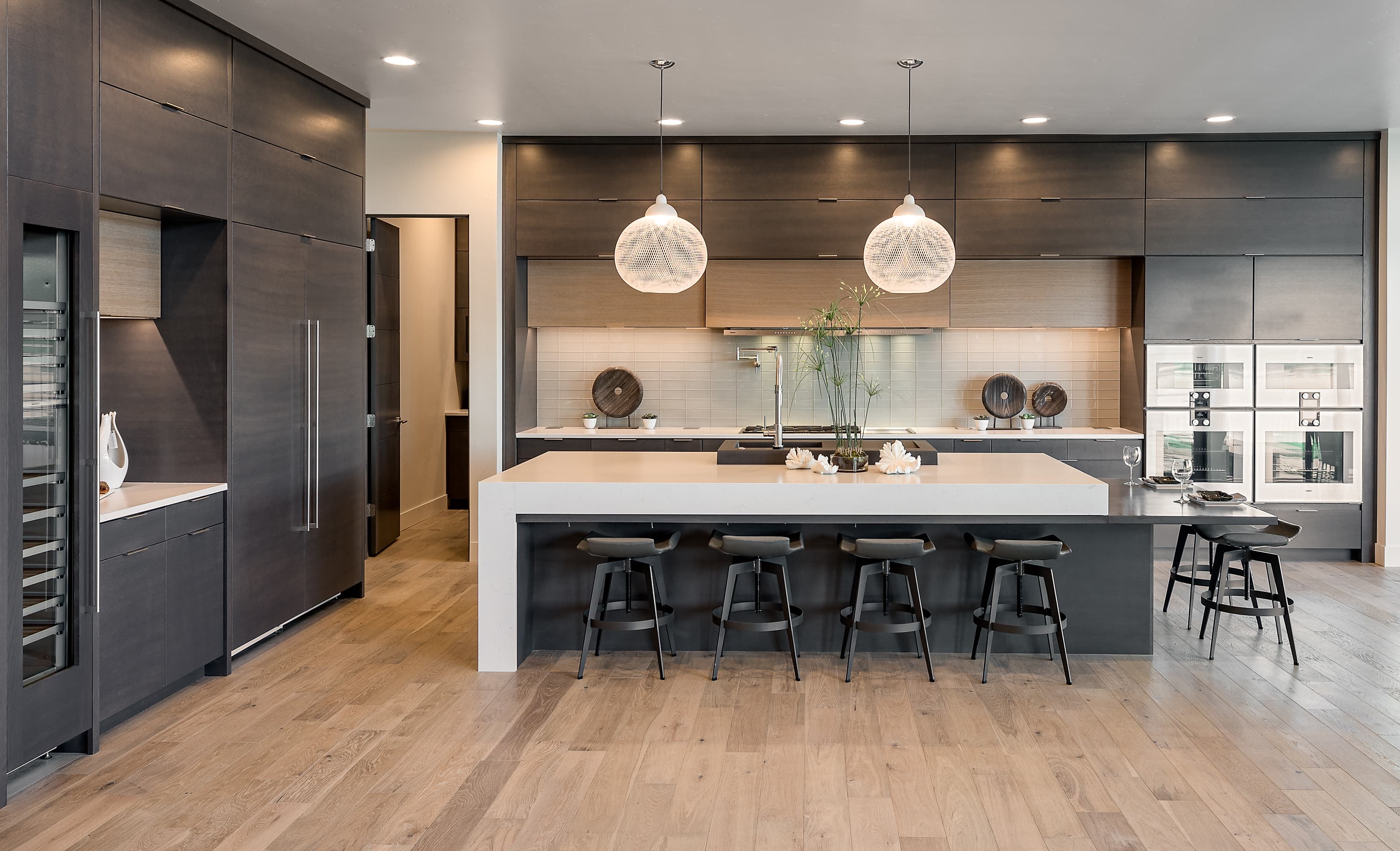 Modern dark kitchen with white stone island